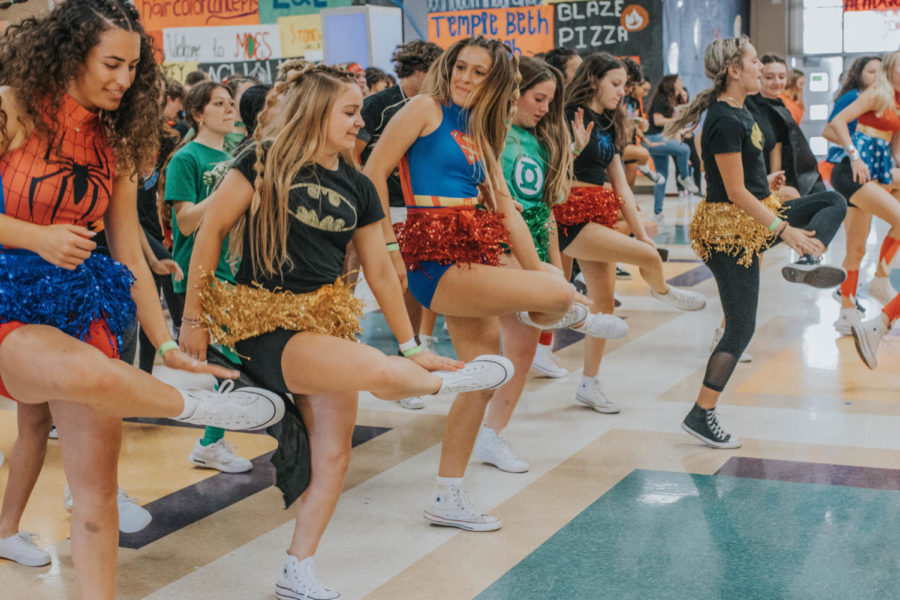 Emma Suggs and Madison Fargo lead the group in a choreographed dance to "Cotton Eye Joe." 