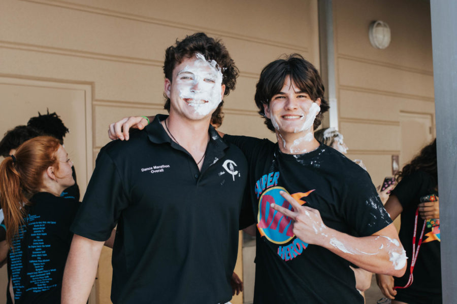 Brothers Collin and Evan Romano get pied for the kids. 