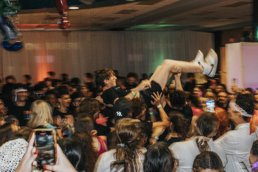 Aaron Volosin crowd surfs his way to the gong.